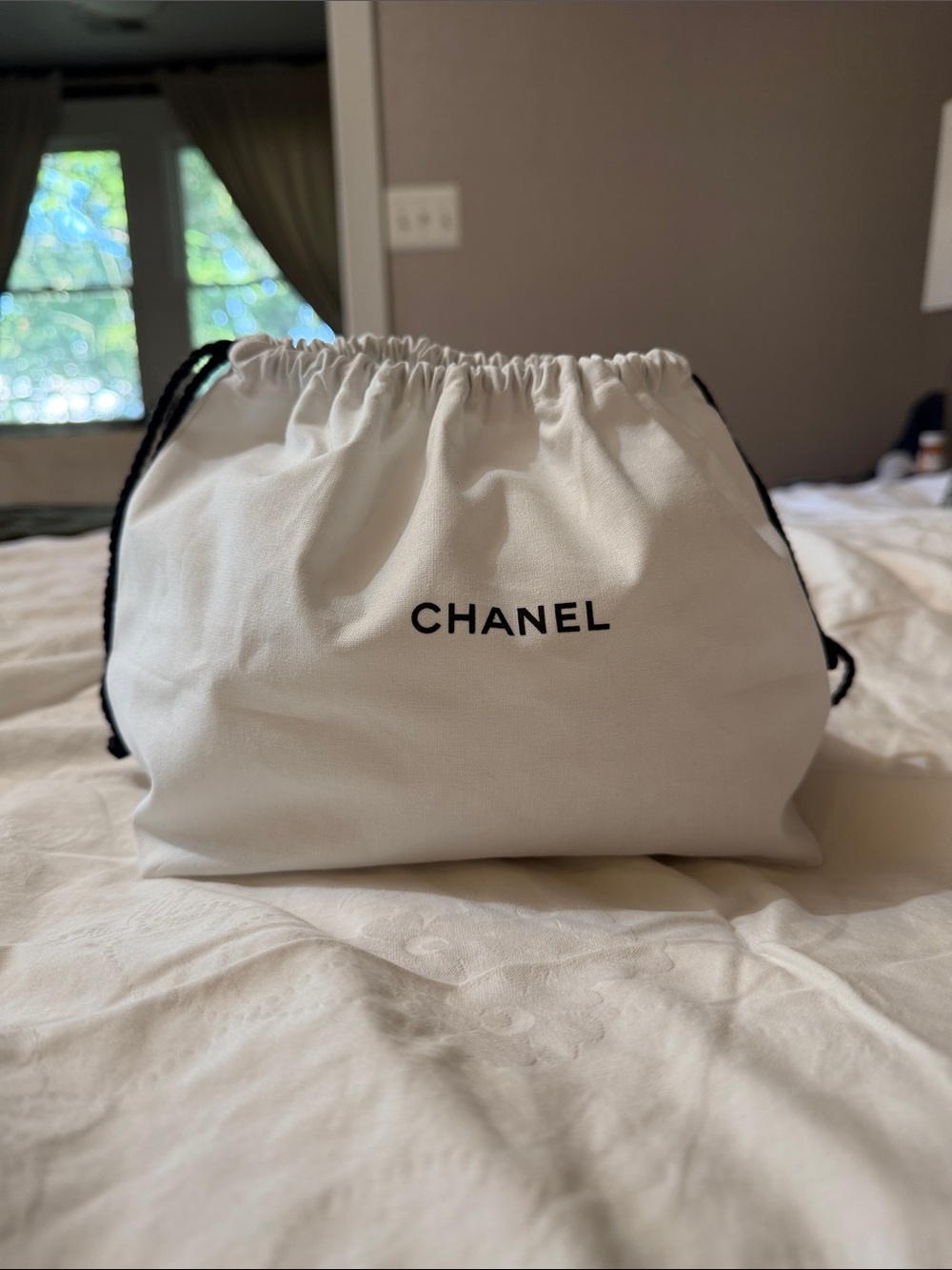 CHANEL White Drawstring Pouch with Black Logo